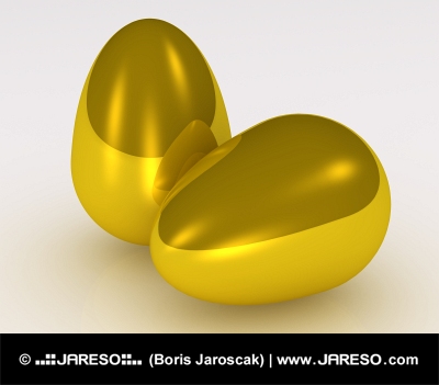 Dvě zlaté vejce na bílém pozadí