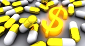 Hodně zlatých pilulek a symbol zářícího dolaru